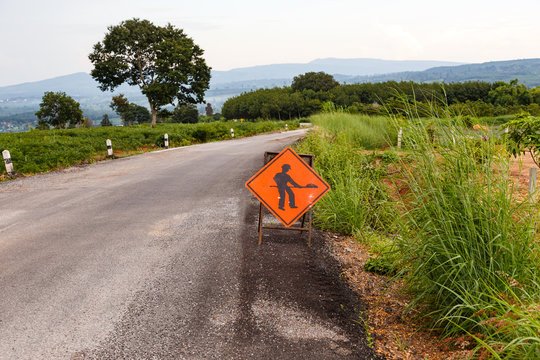 Under construction sign on damage road