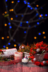 Christmas background on wooden table and copy space, bokeh in the background