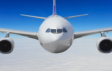 Airplane above the clouds