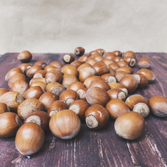 Hazelnuts on a wooden background