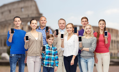 Fototapeta premium group of people with smartphones over coliseum