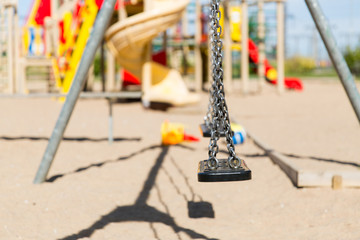 close up of swing on playground outdoors