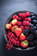 Fresh berries in bowl, antioxidant concept