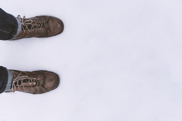 Closeup of hiking boots in the snow