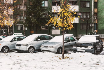 Cars in the parking lot, covered with snow
