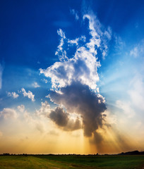 Plakat Beautiful cloudscape with dramatic sun ray beams