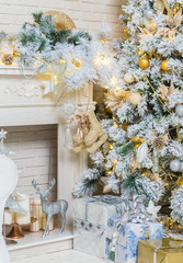 Brightly lit christmas tree with lots of gifts