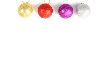 Christmas balls hanging with ribbon bows on white background