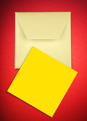Envelope and card on red