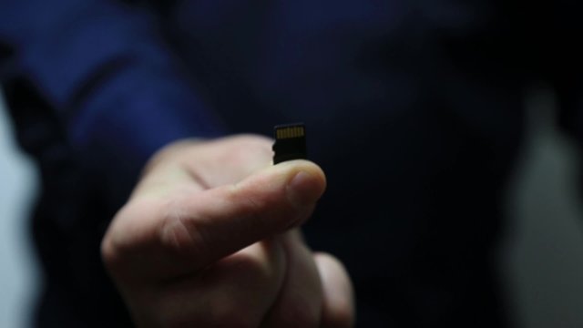 Man holds SD Card 