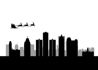 Fototapeta premium santa flying over the city of detroit