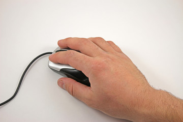 Hand with computer mouse on white background