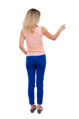Back view of  pointing woman.
