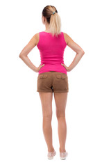 back view of standing young beautiful  woman.