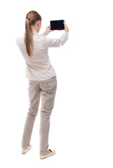 back view of standing young beautiful  girl with tablet computer