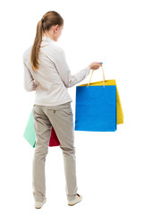 back view of woman with shopping bags .