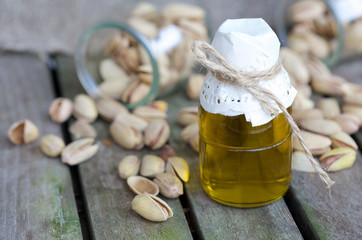Pistachio nuts oil in a glass bottle