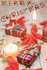 Christmas gift boxes with red ribbons and gold stars
