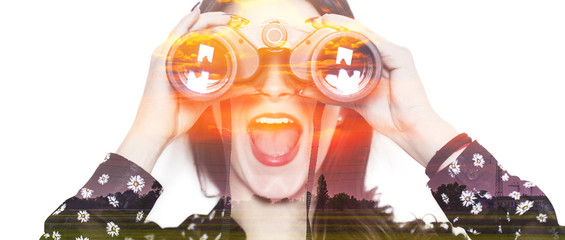 Double exposure of girl with binoculars and sunset letterbox