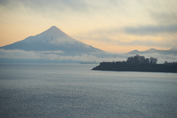 Sunrise over Snow capped Volcano Osorno (2,652 metres) on the edge of Llanquihue Lake in Southern...