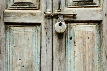 Wooden door shut with a lock