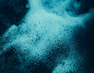 Closeup of a fast flowing water of a mountain stream