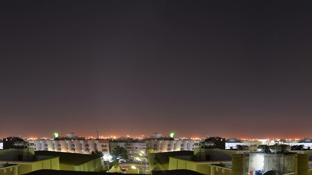 Homes in saudi arabia at night time lapse seamless loop