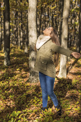 Fototapeta premium Portrait of a happy beautiful teenage girl enjoying the season