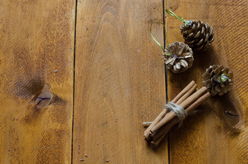 Some cinnamon sticks tied with a natural rope on wooden table. 