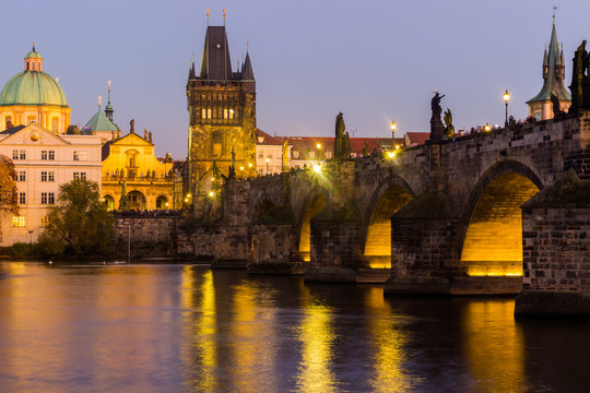 View at The Charles Bridge and Vltava river in Prague in dusk at sunset, Czech Republic