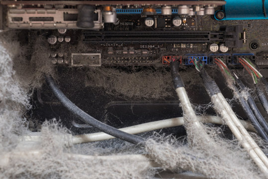 The main components of the outdated, dusty and non-working computer, supply and data cables. isolated
