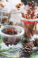 Christmas traditional spices and cookies on a festive rustic wooden table.Selective focus. 