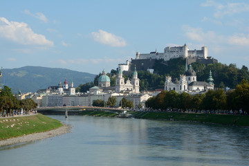 Fototapeta na wymiar Old city at Salzach river in Salzburg in Austria