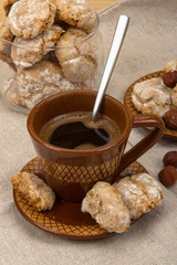 Amaretti with cup of coffee and hazelnuts