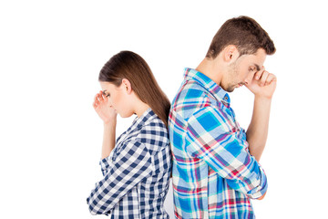 Couple standing back to back