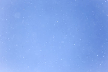 Snow in blue sky