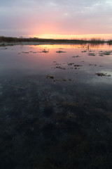 beautiful sunrise of the sun on the lake