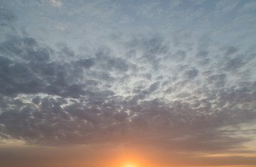 Naklejka na ściany i meble beautiful clouds dawn sun as background