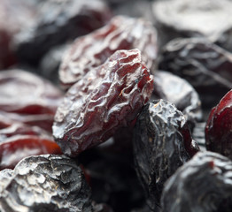 Black raisins as background. macro