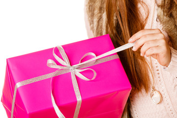 Girl unpaking gift box.
