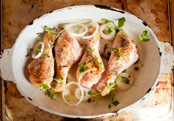 Raw chicken legs with spices