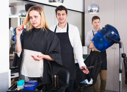 Woman Blaming Hairdresser In Bad Haircut