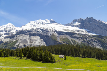 Amazing view of Swiss Alps and meadows near Oeschinensee Lake in Switzerland