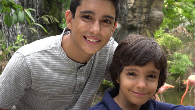 Teen Hispanic Boys Smiling at Zoo