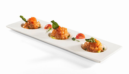 Salmon tartare on white table