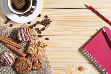 Fototapeta premium Cookies, coffee and notepad on a table