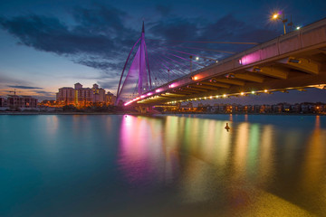 Fototapeta na wymiar Modern bridge during sunset in pink colour