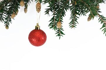Obraz na płótnie Canvas red bauble hanging on Christmas tree branch