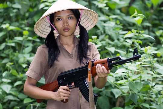 Asian woman armed