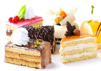 Stoff pro Meter Assorted different mini cakes with cream, chocolate and berries © Olga Kriger